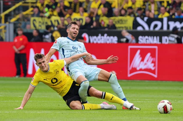 Dortmund, Deutschland: 12.09.2026 - 1. Bundesliga 2026 27 - 3. Spieltag - Borussia Dortmund vs. SC Paderborn Im Bild: v.li. im Zweikampf Nico Schlotterbeck (BVB) und Marvin Pieringer (Paderborn) (DFL DFB REGULATIONS PROHIBIT ANY USE OF PHOTOGRAPHS as IMAGE SEQUENCES and or QUASI-VIDEO) *** *** Dortmund, Germany, September 12, 2026, Bundesliga 2026-27, Matchday 3: Borussia Dortmund vs. SC Paderborn. Pictured from left, in a tackle: Nico Schlotterbeck (BVB) and Marvin Pieringer (Paderborn). DFL and DFB regulations prohibit any use of photographsHS as IMAGE SEQUENCES and or QUASI-VIDEO *** Copyright: HMBxMedia MadeleinexFantini