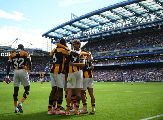 Chelsea v Hull City Premier League Hull City s Mohamed Belloumi is mobbed by team mates as he celebrates scoring their second goal during the Premier League match at Stamford Bridge, London 12 09 2026 UK Newspapers OUT Copyright: xDanielxHamburyx FIL-23926-0104