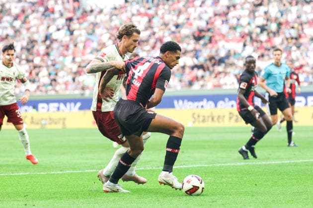 Zweikampf, Calvin Brackelmann (FC Augsburg, 02) mit Jarell Quansah (Bayer 04 Leverkusen, 04), GER, FC Augsburg vs. Bayer 04 Leverkusen, Fussball, Bundesliga, 3. Spieltag, Saison 2026 2027, 12.09.2026, DFL DFB REGULATIONS PROHIBIT ANY USE OF PHOTOGRAPHS as IMAGE SEQUENCES and or QUASI-VIDEO, GER, FC Augsburg vs. Bayer 04 Leverkusen, Fussball, Bundesliga, 3. Spieltag, Saison 2026 2027, 12.09.2026 Augsburg *** Tackle, Calvin Brackelmann (FC Augsburg, 02) vs. Jarell Quansah (Bayer 04 Leverkusen, 04), GER, FC Augsburg vs. Bayer 04 Leverkusen, Soccer, Bundesliga, Matchday 3, 2026–2027 Season, September 12, 2026, DFL and DFB regulations prohibit any use of photographs as image sequences and or quasi-video, GER, FC Augsburg vs. Bayer 04 Leverkusen, soccer, Bundesliga, Matchday 3, 2026–2027 season, September 12, 2026, Augsburg Copyright: xEibner-Pressefoto JennixMaulx EP_JML