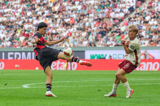 Ibrahim Maza (Bayer 04 Leverkusen, 30) mit Hennes Behrens (FC Augsburg, 16), GER, FC Augsburg vs. Bayer 04 Leverkusen, Fussball, Bundesliga, 3. Spieltag, Saison 2026 2027, 12.09.2026, DFL DFB REGULATIONS PROHIBIT ANY USE OF PHOTOGRAPHS as IMAGE SEQUENCES and or QUASI-VIDEO, GER, FC Augsburg vs. Bayer 04 Leverkusen, Fussball, Bundesliga, 3. Spieltag, Saison 2026 2027, 12.09.2026 Augsburg *** Ibrahim Maza, Bayer 04 Leverkusen, 30; Hennes Behrens, FC Augsburg, 16; GER; FC Augsburg vs. Bayer 04 Leverkusen; Soccer; Bundesliga; Matchday 3; 2026–2027 Season; September 12, 2026, DFL and DFB regulations prohibit any use of photographs as image sequences and or quasi-video, GER, FC Augsburg vs. Bayer 04 Leverkusen, Soccer, Bundesliga, Matchday 3, 2026–2027 season, September 12, 2026, Augsburg Copyright: xEibner-Pressefoto JennixMaulx EP_JML