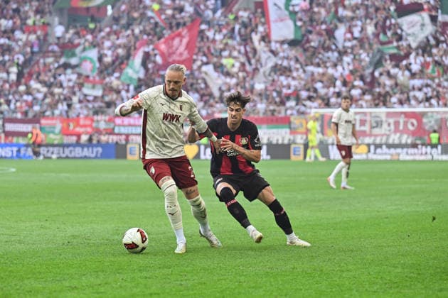 1. Fussball Bundesliga: FC Augsburg - Bayer 04 Leverkusen, 12.09.2026 AUGSBURG, GERMANY; 12. SEPTEMBER: im Duell Marius WOLF (FC Augsburg 27) und Afonso MOREIRA (Bayer Leverkusen 9) während dem Match der Bundesliga zwischen dem FC Augsburg und Bayer 04 Leverkusen am 3. Spieltag in der WWK-Arena DFL REGULATIONS PROHIBIT ANY USE OF PHOTOGRAPHS AS IMAGE SEQUENCES AND OR QUASI-VIDEO *** 1 Bundesliga: FC Augsburg vs. Bayer 04 Leverkusen, September 12, 2026, AUGSBURG, GERMANY, September 12: Marius WOLF (FC Augsburg, No. 27) and Afonso MOREIRA (Bayer Leverkusen, No. 9) face off during the Bundesliga match between FC Augsburg and Bayer 04 Leverkusen on Matchday 3 at the WWK Arena. DFL REGULATIONS PROHIBIT ANY USE OF PHOTOGRAPHS AS IMAGE SEQUENCES OR QUASI-VIDEO Copyright: xBEAUTIFULxSPORTS Goldbergx