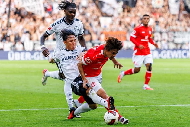 MAINZ, GERMANY - SEPTEMBER 12: Kaishu Sano (1. FSV Mainz 05, 6) is challenged by Keita Kosugi (Eintracht Frankfurt, 26) during the Bundesliga match between 1. FSV Mainz 05 vs. Eintracht Frankfurt at MEWA Arena on matchday 3 of the 1. Bundesliga on September 12, 2026 in Mainz, Germany. DFL REGULATIONS PROHIBIT ANY USE OF PHOTOGRAPHS AS IMAGE SEQUENCES AND OR QUASI-VIDEO. Rhineland-Palatinate Germany Copyright: xStephanxHahnex