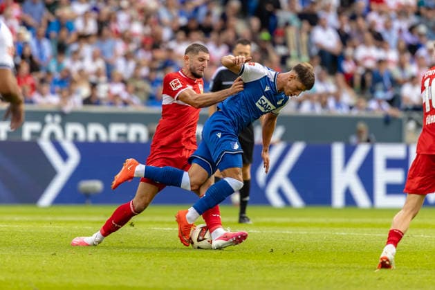 Harter Zweikampf Jeff Chabot (VfB Stuttgart, 24) Adam Hlozek (TSG Hoffenheim, 10) faellt zu Boden, GER, TSG Hoffenheim vs. VfB Stuttgart, Fussball, 1. Bundesliga, 03. Spieltag, Spielzeit 2026 2027, 12.09.2026, DFL DFB REGULATIONS PROHIBIT ANY USE OF PHOTOGRAPHS AS IMAGE SEQUENCES AND OR QUASI-VIDEO, GER, TSG Hoffenheim vs. VfB Stuttgart, Fussball, 1. Bundesliga, 03. Spieltag, Spielzeit 2026 2027, 12.09.2026 Sinsheim *** Fierce tackle: Jeff Chabot (VfB Stuttgart), 24, and Adam Hlozek (TSG Hoffenheim), 10, falls to the ground, GER, TSG Hoffenheim vs. VfB Stuttgart, Soccer, Bundesliga 1, Matchday 03, 2026–2027 season, September 12, 2026, DFL and DFB regulations prohibit any use of photographs as image sequences and or quasi-video, GER, TSG Hoffenheim vs. VfB Stuttgart, soccer, Bundesliga 1, Matchday 3, 2026–2027 Season, September 12, 2026, Sinsheim Copyright: xEibner-Pressefoto JanixPlessx EP_JPL
