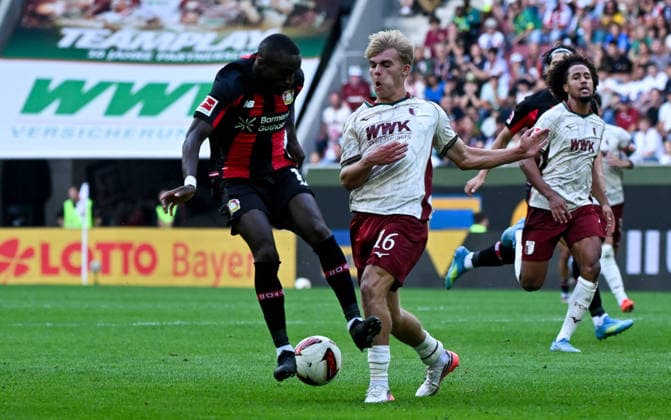 12.09.2026, xemx, Fussball 1.Bundesliga, FC Augsburg - Bayer 04 Leverkusen v.l. Moussa Diaby (Bayer 04 Leverkusen), Hennes Behrens (FC Augsburg) Zweikampf, Aktion, action, battle for the ball (DFL DFB REGULATIONS PROHIBIT ANY USE OF PHOTOGRAPHS as IMAGE SEQUENCES and or QUASI-VIDEO) Augsburg *** September 12, 2026, xemx, Soccer, Bundesliga 1, FC Augsburg vs. Bayer 04 Leverkusen, featuring Moussa Diaby of Bayer 04 Leverkusen, Hennes Behrens, FC Augsburg, tackle, action, battle for the ball. DFL and DFB regulations prohibit any use of photographs as image sequences and or quasi-video. Augsburg