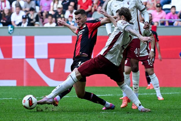 12.09.2026, xemx, Fussball 1.Bundesliga, FC Augsburg - Bayer 04 Leverkusen v.l. Patrick Schick (Bayer 04 Leverkusen), Calvin Brackelmann (FC Augsburg) Zweikampf, Aktion, action, battle for the ball (DFL DFB REGULATIONS PROHIBIT ANY USE OF PHOTOGRAPHS as IMAGE SEQUENCES and or QUASI-VIDEO) Augsburg *** September 12, 2026, xemx, Soccer, Bundesliga 1, FC Augsburg vs. Bayer 04 Leverkusen, Patrick Schick (Bayer 04 Leverkusen), Calvin Brackelmann, FC Augsburg, tackle, action, battle for the ball. DFL and DFB regulations prohibit any use of photographs as image sequences and or quasi-video. Augsburg