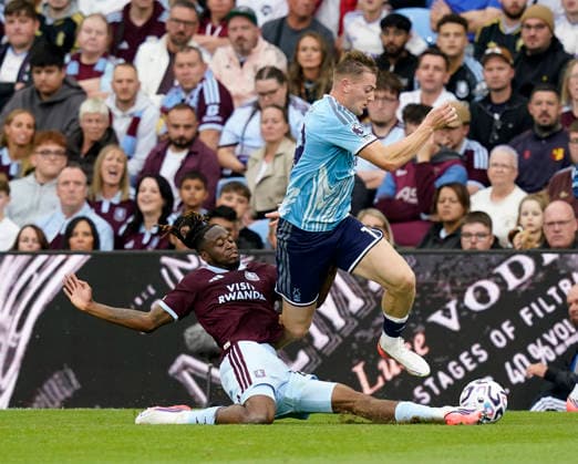 Birmingham, England, 12th September 2026. Aaron Wan-Bissaka of Aston Villa tackles Liam Delap of Nottingham Forest during the Aston Villa vs Nottingham Forest Premier League match at Villa Park, Birmingham. Picture credit should read: Andrew Yates Sportimage EDITORIAL USE ONLY. No use with unauthorised audio, video, data, fixture lists, club league logos or live services. Online in-match use limited to 120 images, no video emulation. No use in betting, games or single club league player publications. SPI_019_AY_Villa_Forest SPI-4990-0019