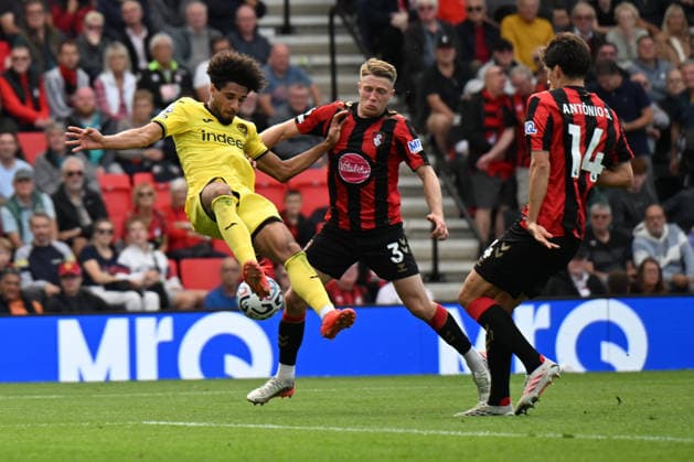 12th September 2026; Vitality Stadium, Bournemouth, England; Premier League Football, Bournemouth versus Brentford; Adrien Truffert of AFC Bournemouth tackles Kevin Schade of Brentford FC SimonxWest