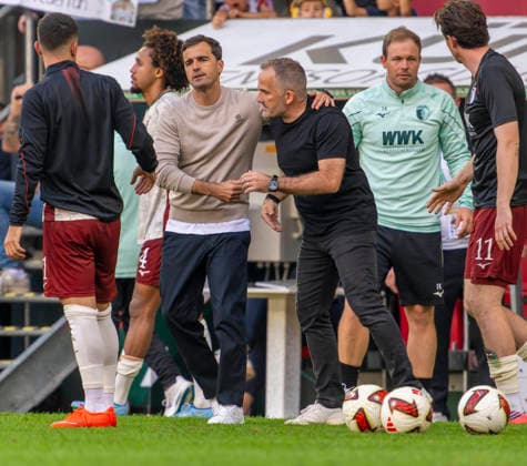 12.09.2026, Fussball Bundesliga 2026 2027, 3.Spieltag, FC Augsburg - Bayer Leverkusen, in der WWK-Arena Augsburg, v.li: Trainer Carles Martinez (Bayer Leverkusen) shakehands mit Trainer Manuel Baum (FC Augsburg) ***DFL and DFB regulations prohibit any use of photographs as image sequences and or quasi-video.*** *** September 12, 2026, 2026–2027 Bundesliga, Matchday 3, FC Augsburg vs. Bayer Leverkusen, at the WWK Arena in Augsburg, from left: Coach Carles Martinez of Bayer Leverkusen shaking hands with Coach Manuel Baum of FC Augsburg ***DFL and DFB regulations prohibit any use of photographs as image sequences and or quasi-video***
