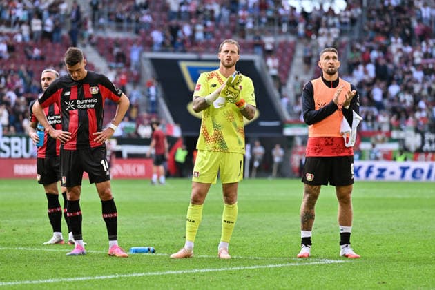 1. Fussball Bundesliga: FC Augsburg - Bayer 04 Leverkusen, 12.09.2026 AUGSBURG, GERMANY; 12. SEPTEMBER: hängende Köpfe der Gäste nach dem 2-2 in Augsburg nach dem Match der Bundesliga zwischen dem FC Augsburg und Bayer 04 Leverkusen am 3. Spieltag in der WWK-Arena DFL REGULATIONS PROHIBIT ANY USE OF PHOTOGRAPHS AS IMAGE SEQUENCES AND OR QUASI-VIDEO Patrik SCHICK (Bayer Leverkusen 14), Mark FLEKKEN (Bayer Leverkusen 1) und Robert ANDRICH (Bayer Leverkusen 8) *** 1 Bundesliga Soccer: FC Augsburg vs. Bayer 04 Leverkusen, September 12, 2026, AUGSBURG, GERMANY SEPTEMBER 12: The visitors hang their heads after the 2-2 draw in Augsburg following the Bundesliga match between FC Augsburg and Bayer 04 Leverkusen on Matchday 3 at the WWK Arena. DFL REGULATIONS PROHIBIT ANY USE OF PHOTOGRAPHS AS IMAGE SEQUENCES AND OR QUASI-VIDEO Patrik SCHICK (Bayer Leverkusen, 14), Mark FLEKKEN (Bayer Leverkusen, 1), and Robert ANDRICH (Bayer Leverkusen, 8) Copyright: xBEAUTIFULxSPORTS Goldbergx