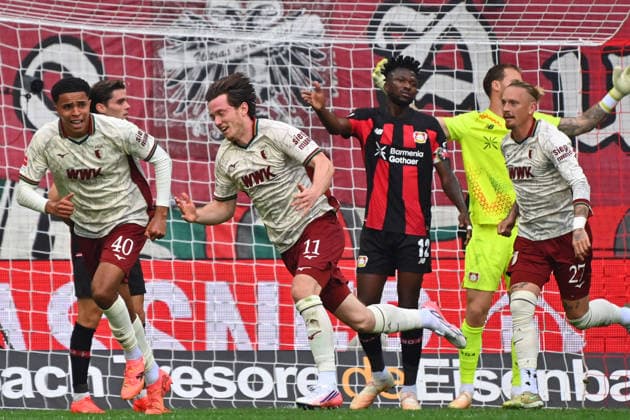 Torjubel Michael GREGORITSCH (FC Augsburg) mit li:Noahkai BANKS (FC Augsburg), re:Fabian RIEDER (FC Augsburg),Chrislain MATSIMA (FC AUGSBURG), re:Edmond TAPSOBA (Bayer Leverkusen), Marius WOLF (FC Augsburg),Torwart Mark FLEKKEN (Bayer Leverkusen) Jubel,Freude,Begeisterung,Aktion, Fussball 1. Bundesliga Saison 2026 2027, 3.Spieltag, Spieltag03, FC Augsburg - Bayer 04 Leverkusen 2-2 am 12.09.2026 , WWK A R E N A. *** Goal celebration: Michael GREGORITSCH (FC Augsburg) with Noahkai BANKS (FC Augsburg) on the left, Fabian RIEDER (FC Augsburg) on the right, Chrislain MATSIMA (FC Augsburg), and Edmond TAPSOBA (Bayer Leverkusen) on the right, Marius WOLF (FC Augsburg), goalkeeper Mark FLEKKEN (Bayer Leverkusen); celebration, joy, excitement, action, soccer, Bundesliga Season 2026–2027, Matchday 3, Matchday 03, FC Augsburg vs. Bayer 04 Leverkusen 2–2 on September 12, 2026, WWK Arena
