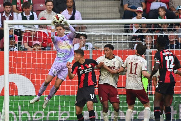 Torwart Finn DAHMEN (FC Augsburg) pariert den Ball,Parade,re:Patrik SCHICK (Bayer Leverkusen), Han-Noah MASENGO (FC Augsburg), Michael GREGORITSCH (FC Augsburg),Edmond TAPSOBA (Bayer Leverkusen).Aktion. Fussball 1. Bundesliga Saison 2026 2027, 3.Spieltag, Spieltag03, FC Augsburg - Bayer 04 Leverkusen 2-2 am 12.09.2026 , WWK A R E N A. *** Goalkeeper Finn DAHMEN of FC Augsburg makes a save; save by Patrik SCHICK of Bayer Leverkusen, Han Noah MASENGO of FC Augsburg, Michael GREGORITSCH of FC Augsburg, Edmond TAPSOBA of Bayer Leverkusen; action from the 2026–2027 Bundesliga season, Matchday 3, Matchday 03, FC Augsburg vs. Bayer 04 Leverkusen 2–2 on September 12, 2026, WWK Arena