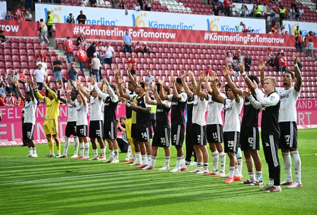 Fussball-Bundesliga - Saison 2026 2027 Mewa-Arena Mainz - 12.09.2026 1. FSV Mainz 05 (mz) - Eintracht Frankfurt (f) 1:3 Die Frankfurter vor ihren Fans, re: Jonathan BURKARDT (Eintracht Frankfurt) DFL REGULATIONS PROHIBIT ANY USE OF PHOTOGRAPHS AS IMAGE SEQUENCES AND OR QUASI VIDEO EDITORIAL USE ONLY NATIONAL AND INTERNATIONAL NEWS AGENCIES OUT Fussball-Bundesliga - 1. FSV Mainz 05 *** Soccer Bundesliga Season 2026–2027 Mewa Arena Mainz September 12, 2026 1 FSV Mainz 05 vs. Eintracht Frankfurt 1–3 Eintracht Frankfurt in front of their fans, Photo by Jonathan BURKARDT Eintracht Frankfurt DFL REGULATIONS PROHIBIT ANY USE OF PHOTOGRAPHS AS IMAGE SEQUENCES AND OR QUASI-VIDEO; EDITORIAL USE ONLY; NATIONAL AND INTERNATIONAL NEWS AGENCIES EXCLUDED. German Bundesliga 1 FSV Mainz 05