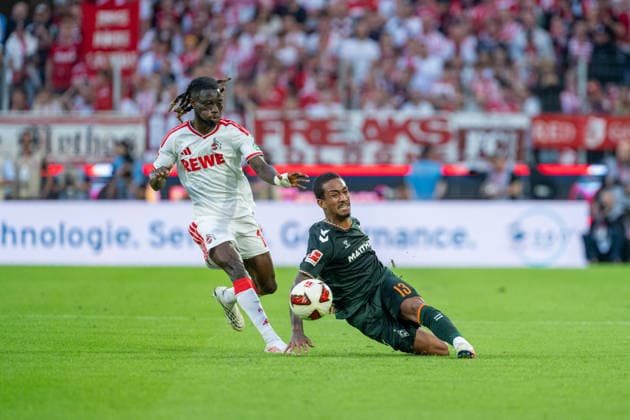 Gideon Mensah (1.FC Koeln, 14) im Zweikampf mit Arthur (SV Werder Bremen, 13) der den Ball beim graetschen passt 1.FC Köln vs. SV Werder Bremen, Fussball, Bundesliga, 3.Spieltag, Saison 2026 27, 12.09.2026, DFL REGULATIONS PROHIBIT ANY USE OF PHOTOGRAPHS AS IMAGE SEQUENCES AND OR QUASI-VIDEO, 1.FC Köln vs. SV Werder Bremen, Fussball, Bundesliga, 3.Spieltag, Saison 2026 27, 12.09.2026 Köln *** Gideon Mensah of 1. FC Köln, No. 14, in a tackle with Arthur of SV Werder Bremen, No. 13, who passes the ball while sliding, 1. FC Köln vs. SV Werder Bremen, Soccer, Bundesliga, Matchday 3, 2026–27 season, September 12, 2026, DFL regulations prohibit any use of photographs as image sequences and or quasi-video, 1. FC Köln vs. SV Werder Bremen, soccer, Bundesliga, Matchday 3, 2026–27 season, September 12, 2026, Cologne Copyright: xEibner-Pressefoto LukasxBaldygax EP_LBA