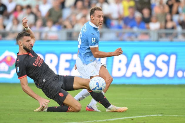 IPA88449226 - Davide Frattesi of Lazio under pressure from Strahinja Pavlovic of Milan during the UEFA Champions League soccer match between Lazio and Milan at the Olimpico Stadium on September 12, 2026, in Lazio, Milan. During the SS Lazio vs. AC Milan Italian Serie A soccer match in Rome, Italy, on September 12, 2026  Copyright: xRobertoxRamaccia IPAxSportx xx IPA88449226