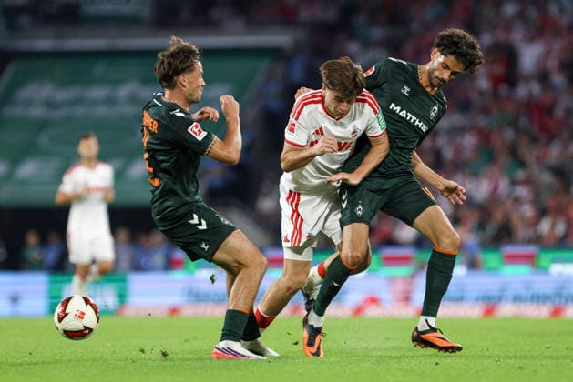 Olivier Deman (SV Werder Bremen), Mikey Moore (1. FC Koeln) und Eren Dinkci (SV Werder Bremen) im Zweikampf waehrend des Spiels der 1. Bundesliga zwischen 1. FC Koeln und SV Werder Bremen, RheinEnergieStadion am 12. September 2026 in Koeln, Deutschland. (Foto von Oliver Kaelke DeFodi Images) +++ Olivier Deman (SV Werder Bremen), Mikey Moore (1. FC Koeln) und Eren Dinkci (SV Werder Bremen) battle for the ball during the Bundesliga match between 1. FC Koeln and SV Werder Bremen at RheinEnergieStadion on September 12, 2026 in Cologne, Germany. (Photo by Oliver Kaelke DeFodi Images) DFB DFL REGULATIONS PROHIBIT ANY USE OF PHOTOGRAPHS AS IMAGE SEQUENCES AND OR QUASI-VIDEO. (Photo by Oliver Kaelke DeFodi Images) - *** Olivier Deman of SV Werder Bremen, Mikey Moore of 1. FC Köln, and Eren Dinkci of SV Werder Bremen in a tackle during the Bundesliga 1 match between 1. FC Köln and SV Werder Bremen, RheinEnergieStadion on September 12, 2026, in Cologne, Germany. Photo by Oliver Kaelke, DeFodi Images. Olivier Deman (SV Werder Bremen), Mikey Moore (1. FC Köln), and Eren Dinkci (SV Werder Bremen) battle for the ball during the Bundesliga match between 1. FC Köln and SV Werder Bremen at RheinEnergieStadion on September 12, 2026 in Cologne, Germany. Photo by Oliver Kaelke, DeFodi Images. DFB and DFL regulations prohibit any use of photographs as image sequences and or quasi-video. Photo by Oliver Kaelke, DeFodi Images.