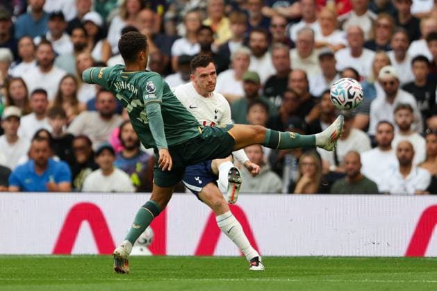 Andrew Robertson of Tottenham Hotspur crosses the ball whilst under pressure from Brennan Johnson of Everton Tottenham Hotspur v Everton, Premier League, Football, Tottenham Hotspur Stadium, London, UK, 12 09 2026, England - 12 Sep 2026London Tottenham Hotspur Stadium England United Kingdom EDITORIAL USE ONLY No use with unauthorised audio, video, data, fixture lists, club league logos or live services. Online in-match use limited to 120 images, no video emulation. No use in betting, games or single club league player publications.  Copyright: xHanc WiredxPhotos Shutterstockx 17148125bh