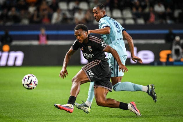 September 12, 2026, Paris, France, France: Lois OPENDA of Lyon and Samir CHERGUI of Paris FC during the Ligue 1 match between Paris FC and Olympique Lyonnais (OL) at Jean-Bouin Stadium on September 12, 2026 in Paris, France. Paris FC V Olympique Lyonnais - Ligue 1  - ZUMAm308 20260912_zsp_m308_005 Copyright: xMatthieuxMirvillex