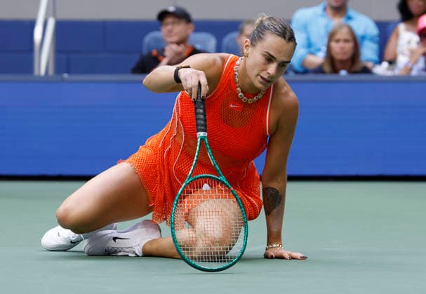 Aryna Sabalenka of Belarus falls after hitting a return to Elena Rybakina of Kazakhstan in the second set of the Women s Finals match in Arthur Ashe Stadium at the 2026 US Open Tennis Championship at the USTA Billie Jean King National Tennis Center in New York City on Saturday, September 12, 2026.  NYP20260912838 JOHNxANGELILLO