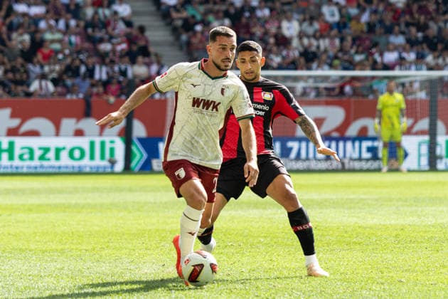 Deutschland: FC Augsburg vs Bayer 04 Leverkusen, 1. Bundesliga, Saison 2026 27, WWK Arena (Augsburg): Arijon Ibrahimovic, (FC Augsburg, 21) am Ball, Equi Fernandez, (Bayer Leverkusen, 6) Augsburg WWK Arena Bayern Deutschland *** Germany: FC Augsburg vs. Bayer 04 Leverkusen, Bundesliga 1, 2026–27 Season, WWK Arena, Augsburg; Arijon Ibrahimovic, FC Augsburg, No. 21 in possession; Equi Fernandez, Bayer Leverkusen, No. 6; Augsburg; WWK Arena; Bavaria; Germany Copyright: xBenedictxChristx