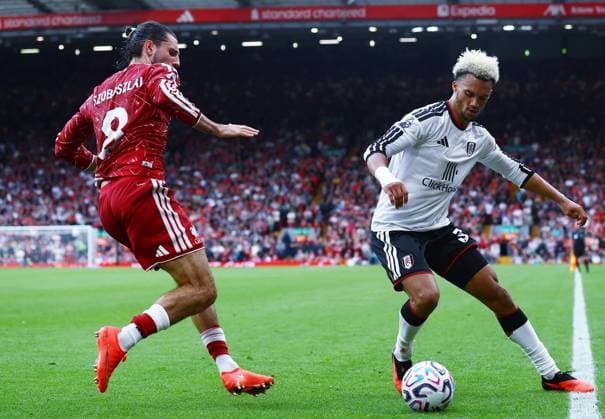 Antonee Robinson of Fulham and Dominik Szoboszlai of Liverpool Liverpool v Fulham, Premier League, Football, Football, Anfield, Liverpool, UK - 12 Sep 2026Liverpool Anfield United Kingdom EDITORIAL USE ONLY No use with unauthorised audio, video, data, fixture lists, club league logos or live services. Online in-match use limited to 120 images, no video emulation. No use in betting, games or single club league player publications. Copyright: xMattxWest Shutterstockx 17144551en
