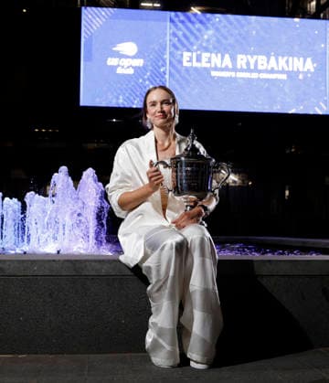 Elena Rybakina of Kazakhstan holds the championship trophy at the fountains in front of Arthur Ashe Stadium after defeating Aryna Sabalenka of Belarus in the Women s Finals match at the 2026 US Open Tennis Championship at the USTA Billie Jean King National Tennis Center in New York City on Saturday, September 12, 2026. Rybakina won with a score of 6-4, 5-7, 6-2.  NYP20260913011 JOHNxANGELILLO