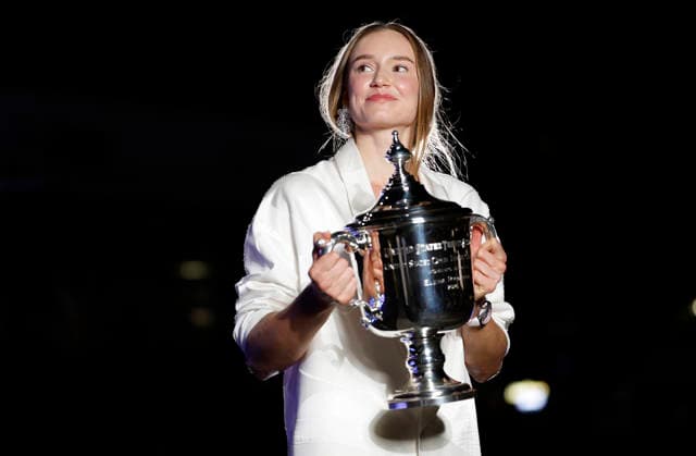 Elena Rybakina of Kazakhstan holds the championship trophy at the fountains in front of Arthur Ashe Stadium after defeating Aryna Sabalenka of Belarus in the Women s Finals match at the 2026 US Open Tennis Championship at the USTA Billie Jean King National Tennis Center in New York City on Saturday, September 12, 2026. Rybakina won with a score of 6-4, 5-7, 6-2.  NYP20260913012 JOHNxANGELILLO