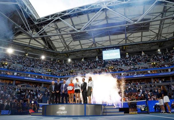 Aryna Sabalenka stands with Elena Rybakina of Kazakhstan who holds the championship trophy after defeating Aryna Sabalenka of Belarus in the Women s Finals match in Arthur Ashe Stadium at the 2026 US Open Tennis Championship at the USTA Billie Jean King National Tennis Center in New York City on Saturday, September 12, 2026. Rybakina won with a score of 6-4, 5-7, 6-2.  NYP20260913020 JOHNxANGELILLO