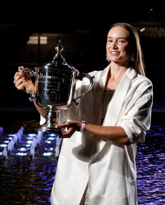 Elena Rybakina of Kazakhstan holds the championship trophy at the fountains in front of Arthur Ashe Stadium after defeating Aryna Sabalenka of Belarus in the Women s Finals match at the 2026 US Open Tennis Championship at the USTA Billie Jean King National Tennis Center in New York City on Saturday, September 12, 2026. Rybakina won with a score of 6-4, 5-7, 6-2.  NYP20260913205 JOHNxANGELILLO