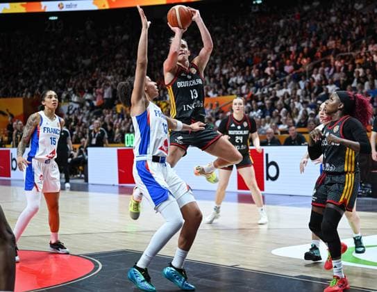 (260913) -- BERLIN, Sept. 13, 2026 -- Leonie Fiebich (top) of Germany shoots during the semifinal match between France and Germany at the FIBA Women s Basketball World Cup 2026 in Berlin, Germany, Sept. 12, 2026. ) (SP)GERMANY-BERLIN-BASKETBALL-WOMEN S WORLD CUP-SEMIFINAL-FRA VS GER ZhangxHaofu 