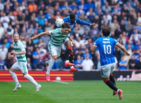 Dujon Sterling of Rangers beats Sebastian Tounekti of Celtic in the air. Rangers v Celtic, Premier Sports Cup Quarter-final, football, Ibrox Stadium, Glasgow, UK, Scotland - 13 Sep 2026Glasgow Ibrox Stadium Scotland United Kingdom  Copyright: xStuartxWallace Shutterstockx 17149154h
