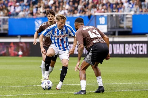 HEERENVEEN , 13-09-2026 , Abe Lenstra Stadium , season 2026 2027 , Dutch Eredivisie football . match between SC Heerenveen and Telstar, Picture shows Telstar player Nils Rossen sc Heerenveen player Levi Smans Telstar player Marvin Peersman Heerenveen - Telstar  x206988393x Copyright:
