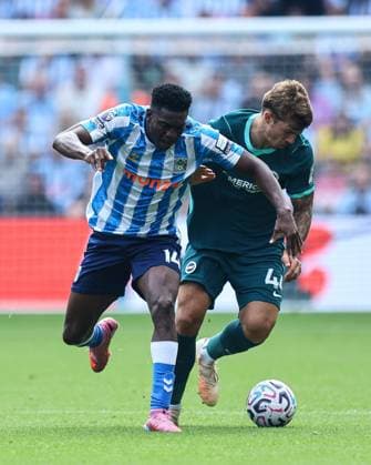 Aurele Amenda of Coventry City battles with b40 Coventry City v Brighton and Hove Albion, Premier League, Football, Football, Coventry Building Society Arena, Coventry, UK - 13 Sep 2026Coventry Coventry Building Society Arena United Kingdom EDITORIAL USE ONLY No use with unauthorised audio, video, data, fixture lists, club league logos or live services. Online in-match use limited to 120 images, no video emulation. No use in betting, games or single club league player publications. Copyright: xMichaelxZemanek Shutterstockx 17144597ad