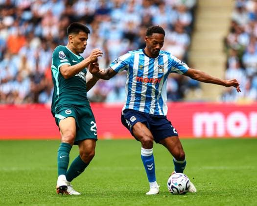 Ethan Pinnock of Coventry City battles with Diego Gomez of Brighton & Hove Albion Coventry City v Brighton and Hove Albion, Premier League, Football, Football, Coventry Building Society Arena, Coventry, UK - 13 Sep 2026Coventry Coventry Building Society Arena United Kingdom EDITORIAL USE ONLY No use with unauthorised audio, video, data, fixture lists, club league logos or live services. Online in-match use limited to 120 images, no video emulation. No use in betting, games or single club league player publications.  Copyright: xJamesxMarsh Shutterstockx 17144596el