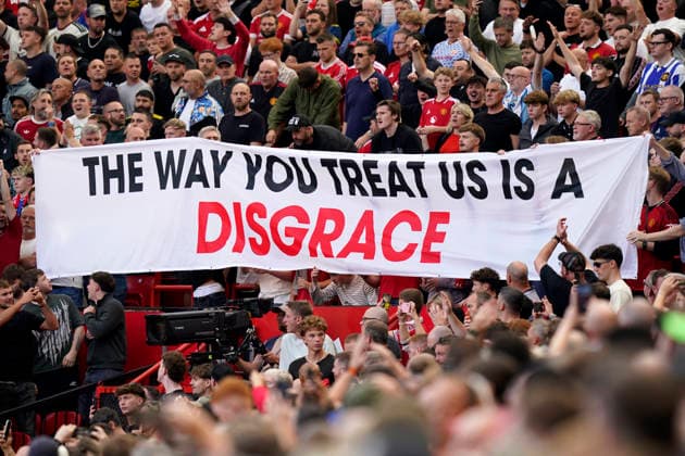 Manchester, England, 13th September 2026. Manchester fans with a protest banner during the Manchester United, ManU vs Manchester City Premier League match at Old Trafford, Manchester. Picture credit should read: Andrew Yates Sportimage EDITORIAL USE ONLY. No use with unauthorised audio, video, data, fixture lists, club league logos or live services. Online in-match use limited to 120 images, no video emulation. No use in betting, games or single club league player publications. SPI_015_AY_MAN_UTD_MAN_CITY SPI-4993-0016