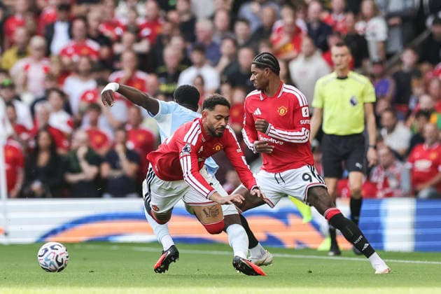 Premier League: Manchester United, ManU v Manchester City Matheus Cunha of Manchester United and Marc Guehi of Manchester City battle for the ball during the Premier League match Manchester United vs Manchester City at Old Trafford, Manchester, United Kingdom on 13 September 2026 (Photo by Mark Cosgrove News Images) Manchester Old Trafford Greater Manchester United Kingdom Copyright: xMarkxCosgrove NewsxImagesx