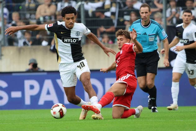 13.09.2026, Fussball, Herren, 1. Bundesliga, Saison 2026 2027, SV 07 Elversberg - FC Bayern München, Francis Onyeka (SV 07 Elversberg), Tom Bischof (FC Bayern München) Elversberg Ursapharm-Arena an der Kaiserlinde Saarland Deutschland (DEU) Copyright: xFabianxKleerx