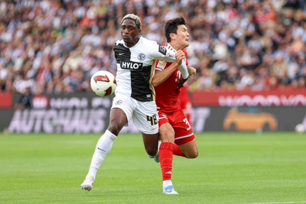 David Mokwa (SV 07 Elversberg) und Min-jae Kim (FC Bayern Muenchen) im Zweikampf waehrend des Spiels der 1. Bundesliga zwischen SV Elversberg und FC Bayern Muenchen, Ursapharm-Arena am 13. September 2026 in Spiesen-Elversberg, Deutschland. (Foto von Oliver Kaelke DeFodi Images) +++ David Mokwa (SV 07 Elversberg) und Min-jae Kim (FC Bayern Muenchen) battle for the ball during the Bundesliga match between SV Elversberg and FC Bayern Muenchen at Ursapharm-Arena on September 13, 2026 in Spiesen-Elversberg, Germany. (Photo by Oliver Kaelke DeFodi Images) DFB DFL REGULATIONS PROHIBIT ANY USE OF PHOTOGRAPHS AS IMAGE SEQUENCES AND OR QUASI-VIDEO. (Photo by Oliver Kaelke DeFodi Images) -