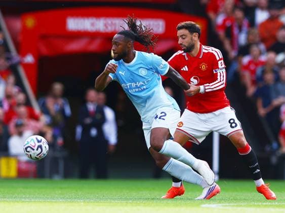 Antoine Semenyo of Manchester City and Bruno Fernandes of Manchester United, ManU Manchester United v Manchester City, Premier League, Football, Football, Old Trafford, Manchester, UK - 13 Sep 2026Manchester Old Trafford United Kingdom EDITORIAL USE ONLY No use with unauthorised audio, video, data, fixture lists, club league logos or live services. Online in-match use limited to 120 images, no video emulation. No use in betting, games or single club league player publications. Copyright: xMattxWest Shutterstockx 17144604ab