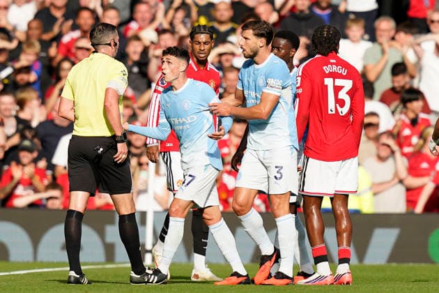 Manchester, England, 13th September 2026. Phil Foden of Manchester City looks on after getting sent off during the Manchester United, ManU vs Manchester City Premier League match at Old Trafford, Manchester. Picture credit should read: Andrew Yates Sportimage EDITORIAL USE ONLY. No use with unauthorised audio, video, data, fixture lists, club league logos or live services. Online in-match use limited to 120 images, no video emulation. No use in betting, games or single club league player publications. SPI_027_AY_MAN_UTD_MAN_CITY SPI-4993-0028