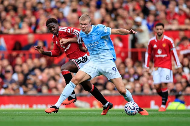 Manchester United, ManU v Manchester City, Premier League Erling Haaland (9) of Manchester City is challenged by Kobbie Mainoo (37) of Manchester United during the Premier League match between Manchester United and Manchester City at Old Trafford, Manchester, UK on 13 September 2026. Manchester Old Trafford Greater Manchester UK Editorial use only DataCo restrictions apply See www.football-dataco.com , Copyright: xConorxMolloyx PSI-24872-0035