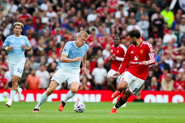 Manchester United, ManU v Manchester City, Premier League Manchester City forward Erling Haaland (9) battles with Manchester United midfielder Bruno Fernandes (8) during the Manchester United v Manchester City Premier League match at Old Trafford, Manchester, England on 13 September 2026 Credit: Phil Duncan Every Second Media Editorial use only. All images are copyright Every Second Media Limited. No images may be reproduced without prior permission. All rights reserved. Premier League and Football League images are subject to licensing agreements with Football DataCo Limited. see https: www.football-dataco.com Copyright: xIMAGO EveryxSecondxMediax ESM-2161-0028 PhilxDuncanx xEveryxSecondxMediax
