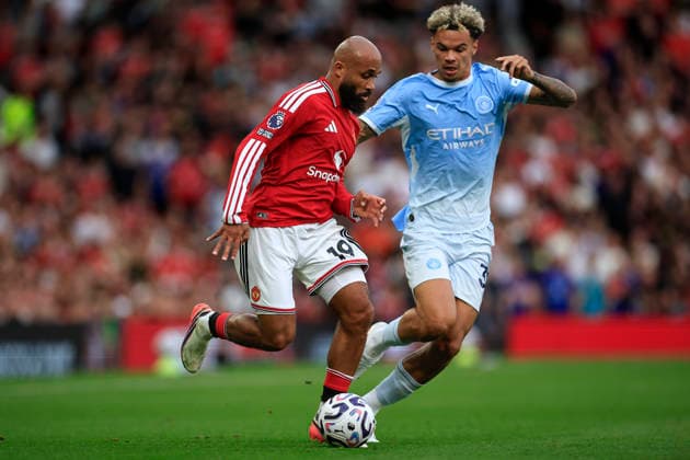 Manchester United, ManU v Manchester City, Premier League Bryan Mbeumo (19) of Manchester United is challenged by Nico O Reilly (33) of Manchester City during the Premier League match between Manchester United and Manchester City at Old Trafford, Manchester, UK on 13 September 2026. Manchester Old Trafford Greater Manchester UK Editorial use only DataCo restrictions apply See www.football-dataco.com , Copyright: xConorxMolloyx PSI-24872-0068