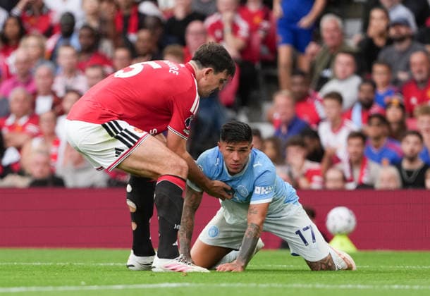 Manchester United, ManU FC v Manchester City FC - Premier League - Season 2026 2027 - Matchday 4 - Old Trafford Manchester UnitedÕs Harry Maguire reacts as Manchester CityÕs Enzo Fernandez rolls around on the pitch during the Manchester United v Manchester City Premier League match at Old Trafford , Manchester , Season 26 27, 13 September 2026 EDITORIAL USE ONLY. No use with unauthorized audio, video, data, fixture lists, club league logos or live services. Online in-match use limited to 45 images, no video emulation. No use in betting, games or single club league player publications Manchester United Kingdom