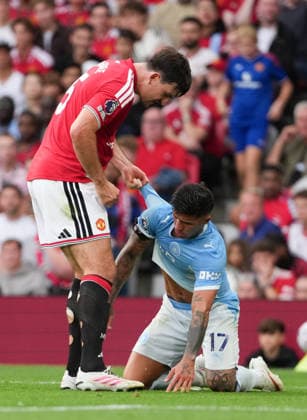 Manchester United, ManU FC v Manchester City FC - Premier League - Season 2026 2027 - Matchday 4 - Old Trafford Manchester UnitedÕs Harry Maguire reacts as Manchester CityÕs Enzo Fernandez rolls around on the pitch during the Manchester United v Manchester City Premier League match at Old Trafford , Manchester , Season 26 27, 13 September 2026 EDITORIAL USE ONLY. No use with unauthorized audio, video, data, fixture lists, club league logos or live services. Online in-match use limited to 45 images, no video emulation. No use in betting, games or single club league player publications Manchester United Kingdom