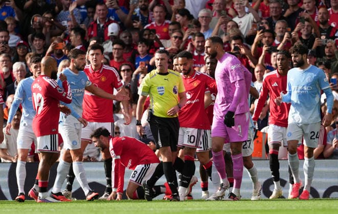 Manchester United, ManU FC v Manchester City FC - Premier League - Season 2026 2027 - Matchday 4 - Old Trafford Manchester UnitedÕs Bruno Fernandes is floored as Manchester CityÕs Phil Foden is red carded during the Manchester United v Manchester City Premier League match at Old Trafford , Manchester , Season 26 27, 13 September 2026 EDITORIAL USE ONLY. No use with unauthorized audio, video, data, fixture lists, club league logos or live services. Online in-match use limited to 45 images, no video emulation. No use in betting, games or single club league player publications Manchester United Kingdom