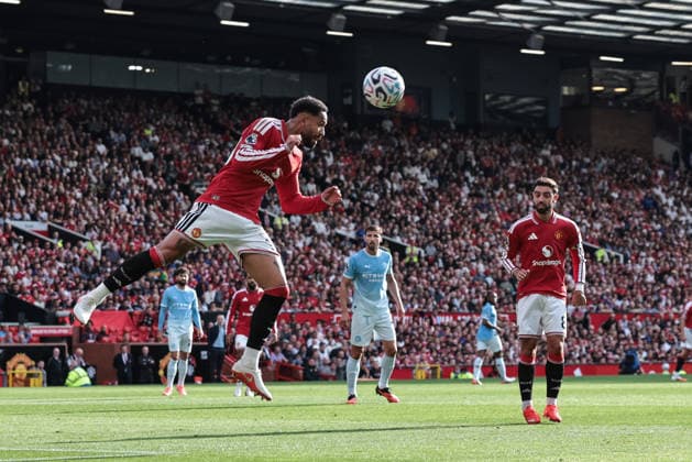 Premier League: Manchester United, ManU v Manchester City Matheus Cunha of Manchester United heads the ball clear of his defensive area during the Premier League match Manchester United vs Manchester City at Old Trafford, Manchester, United Kingdom on 13 September 2026 (Photo by Mark Cosgrove News Images) Manchester Old Trafford Greater Manchester United Kingdom Copyright: xMarkxCosgrove NewsxImagesx