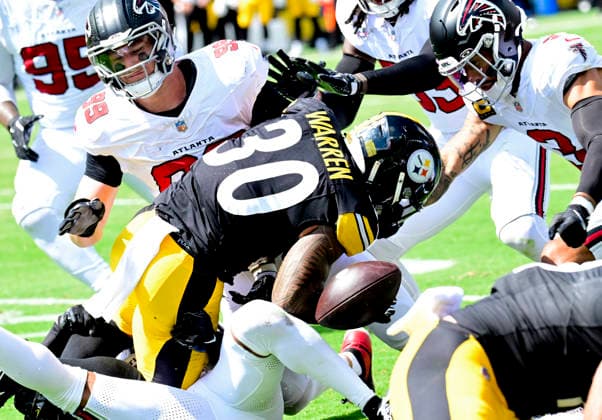 Pittsburgh Steelers running back Jaylen Warren (30) fumbles in the first quarter and the Atlanta Falcons recovers the ball at Acrisure Stadium on Sunday, Sept. 13, 2026 in Pittsburgh.  PIT2026091308a ARCHIExCARPENTER