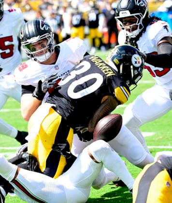 Pittsburgh Steelers running back Jaylen Warren (30) fumbles in the first quarter and the Atlanta Falcons recovers the ball at Acrisure Stadium on Sunday, Sept. 13, 2026 in Pittsburgh.  PIT2026091308 ARCHIExCARPENTER
