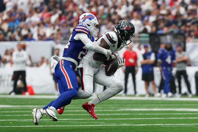 HOUSTON, TX - SEPTEMBER 13: Wide receiver Nico Collins 12 of the Houston Texans is able to hang onto the ball as safety Cole Bishop 24 of the Buffalo Bills wraps him up during the NFL, American Football Herren, USA game between the Houston Texans and the Buffalo Bills on September 13, 2026, at Reliant Stadium in Houston, TX.(Photo by David Buono Icon Sportswire) NFL: SEP 13 Bills at Texans EDITORIAL USE ONLY Icon260913031