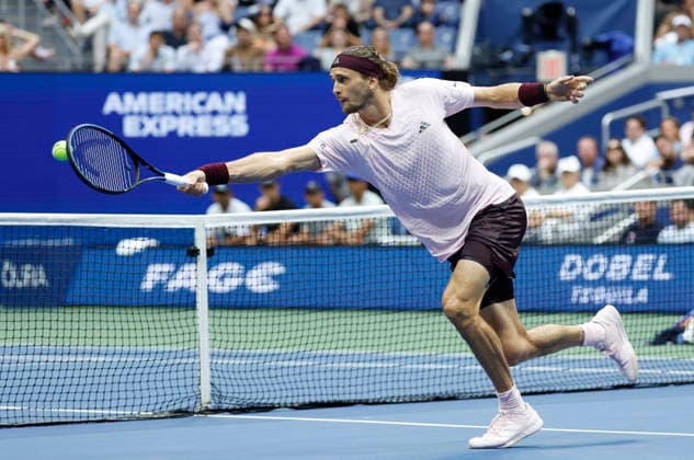 Alexander Zverev of Germany stretches to return the ball to Ben Shelton in the fourth set of the Men s Finals match in Arthur Ashe Stadium at the 2026 US Open Tennis Championship at the USTA Billie Jean King National Tennis Center in New York City on Sunday, September 13, 2026.  NYP20260913854 COREYxSIPKIN